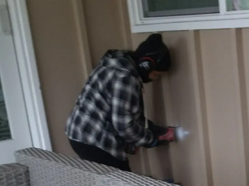 Professional electrician installing an exterior outlet in Benbrook