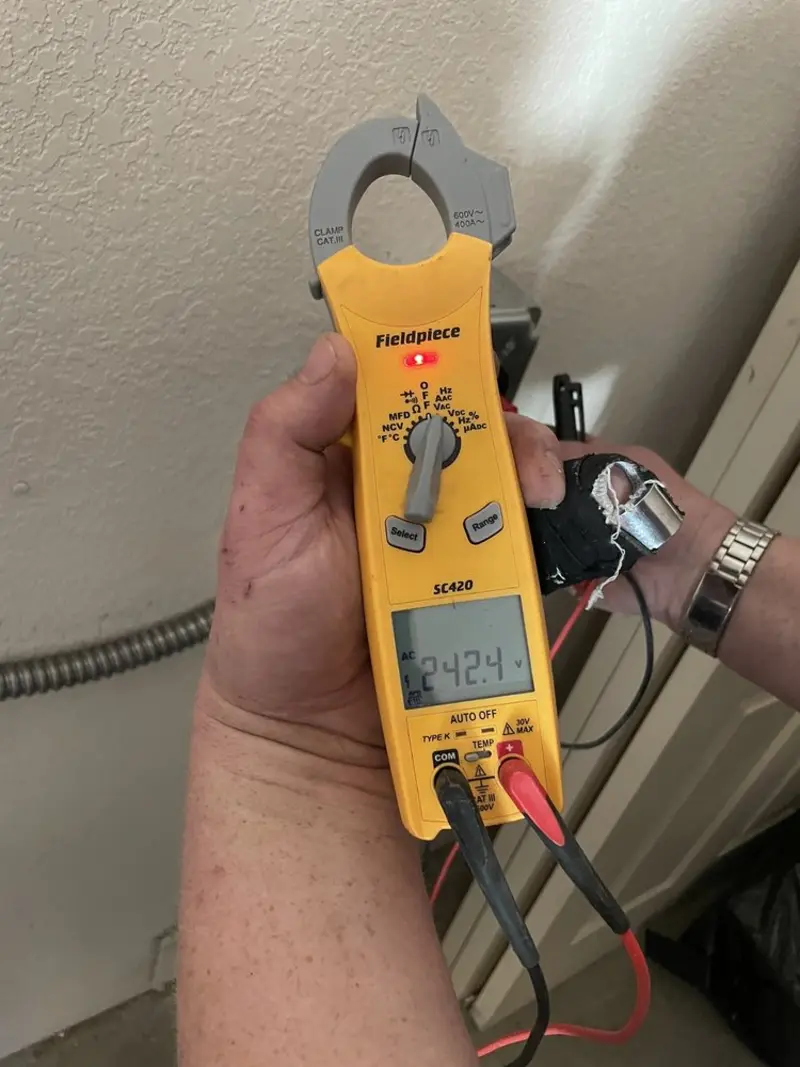 Voltage testing with clamp meter during Generator Installation in Benbrook